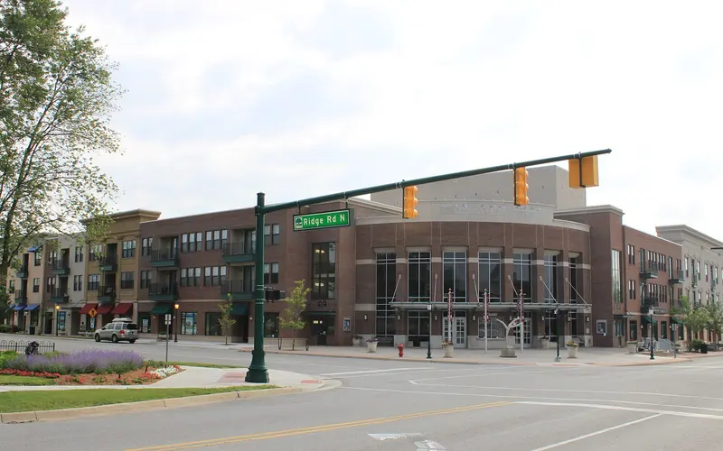 A condominium community building with landscaped grounds in a Metro Detroit suburb