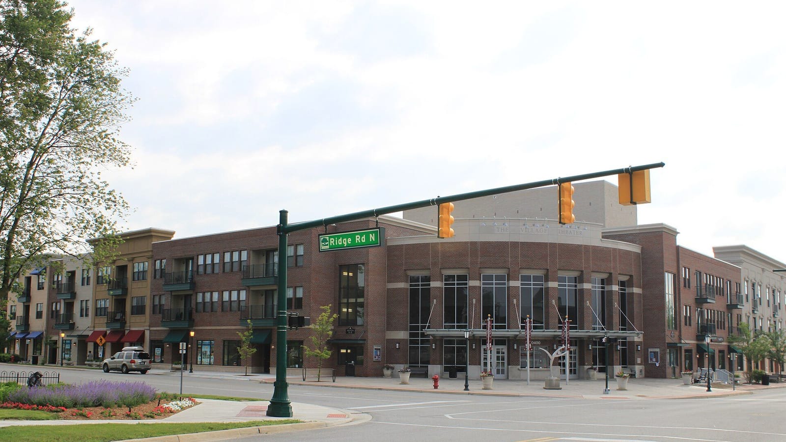 A condominium community building with landscaped grounds in a Metro Detroit suburb