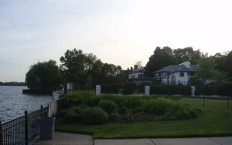 Tree-lined residential street with historic homes near Lake St. Clair in Grosse Pointe, MI