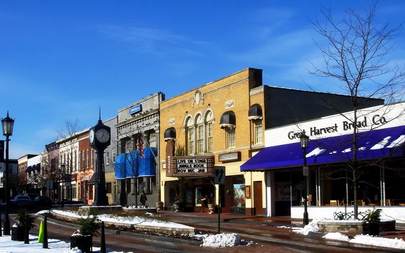 Historic downtown Northville, Michigan, with restored Victorian storefronts and tree-lined Main Street